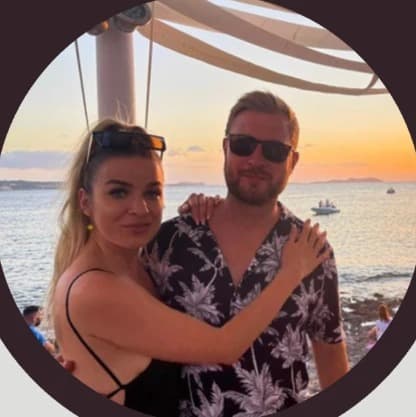 Maciej and Magda by the sea at sunset